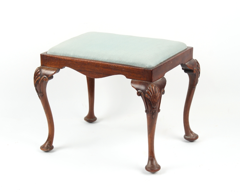 Property of a gentleman - an early 20th century George II style carved walnut cabriole leg stool,