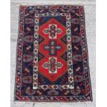 Property of a deceased estate - an Anatolian hand knotted wool rug, with navy field, 72 by 48ins. (