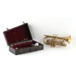 The Henry & Tricia Byrom Collection - a brass trumpet with mother-of-pearl inset buttons, in black