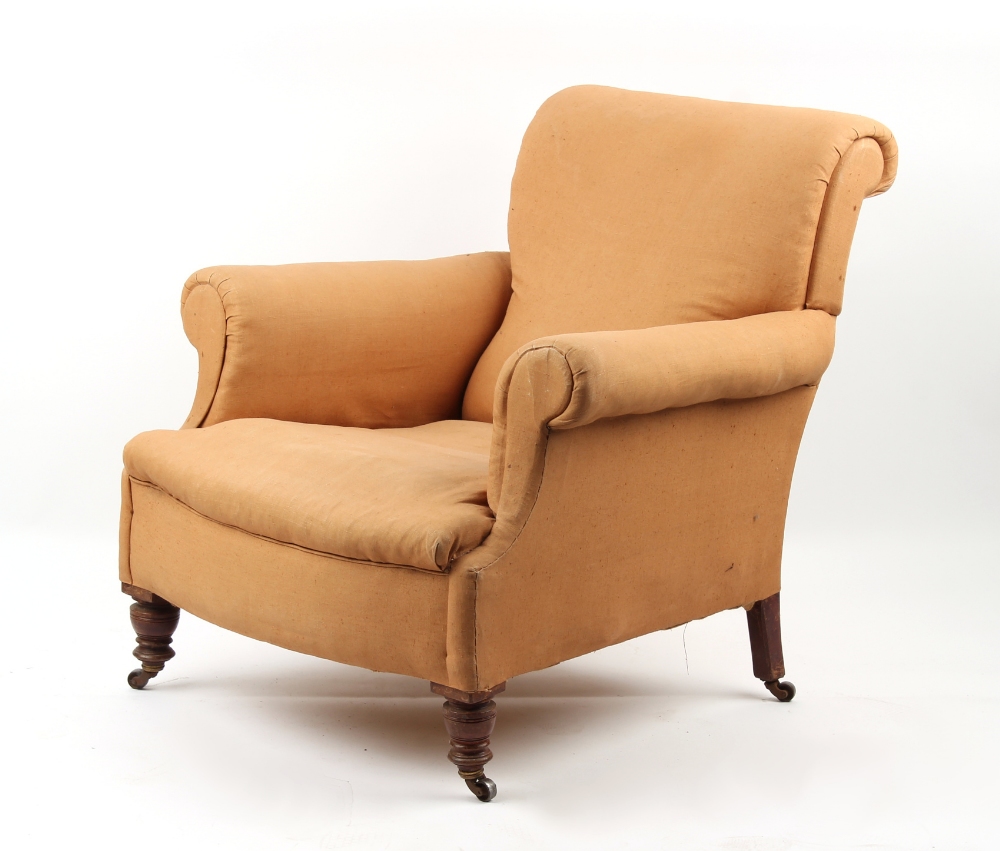 Property of a gentleman - a Victorian upholstered armchair, with turned front legs & castors.