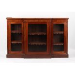 Property of a gentleman - an early Victorian mahogany breakfront dwarf bookcase, with three glazed