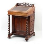 The Henry & Tricia Byrom Collection - an early Victorian rosewood davenport, with tapering