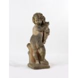 Property of a gentleman - a well weathered reconstituted stone figure of a putto, 35.75ins. (91cms.)