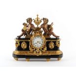 Property of a gentleman - a late 19th century French bronze gilt brass & black marble cased mantel