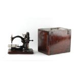 The Henry & Tricia Byrom Collection - a 19th century Willcox & Gibbs sewing machine, boxed.