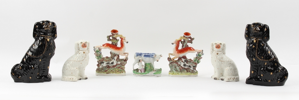 Property of a gentleman - two pairs of Victorian Staffordshire models of seated spaniels, the taller