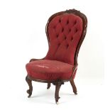 Property of a lady - a Victorian carved walnut & red button upholstered spoon-back nursing chair,