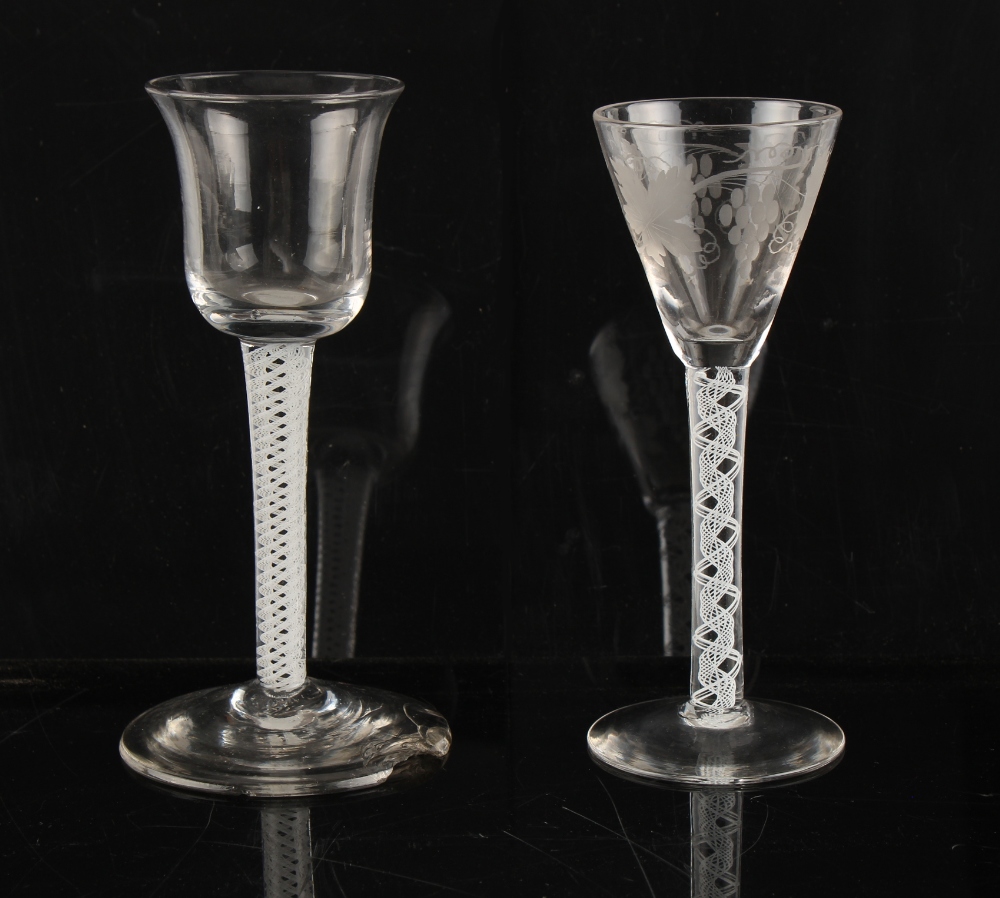 Property of a lady - an 18th century opaque air twist stem glass with bell shaped bowl, chips to