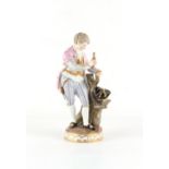 Property of a gentleman - a Meissen figure of a young man collecting sticks in his hat, circa
