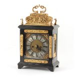 The Henry & Tricia Byrom Collection - a gilt metal mounted ebonised table clock with basket top,