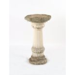 Property of a gentleman - a weathered reconstituted stone garden bird bath, 34.25ins. (87cms.) high.