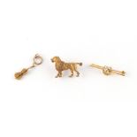 Property of a gentleman - an unmarked yellow gold (tests 9ct) dog brooch, 33mm long, approximately