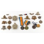 Property of a deceased estate - a tin containing assorted military medals & military badges