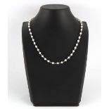 An 18ct white gold & pearl necklace chain necklace, the forty-five untested uniform pearls each