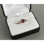 A Georgian unmarked yellow gold amethyst & diamond ring, the rounded rectangular cut amethyst in