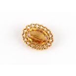 Property of a deceased estate - a good grade 18ct yellow gold citrine brooch, the oval cut citrine