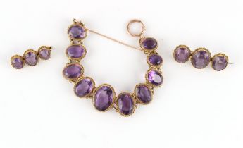 Property of a lady - a Victorian unmarked yellow gold amethyst ten stone oval panel bracelet,
