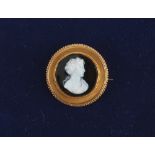 A 19th century carved agate stone cameo brooch depicting a classical female head, with suspension