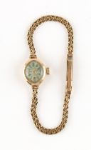 Property of a lady - a lady's Oriosa 9ct gold cased mechanical wristwatch, on 9ct gold bracelet