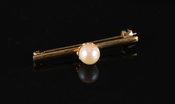 Property of a gentleman - a 22ct yellow gold bar brooch set with a single untested pearl, 33mm