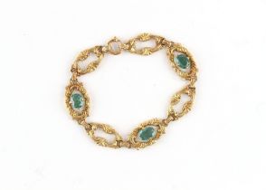 Property of a lady - an unmarked yellow gold (tests 14ct) link bracelet set with three oval cut
