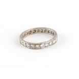 Property of a lady - a platinum or white gold diamond eternity ring, the estimated total diamond