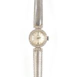 Property of a deceased estate - a lady's Omega 18ct white gold cocktail watch with diamond bezel,