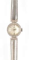 Property of a deceased estate - a lady's Omega 18ct white gold cocktail watch with diamond bezel,