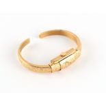 Property of a deceased estate - a lady's Swiss 18ct yellow gold bracelet watch of torc bangle form