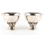 Property of a gentleman - Georg Jensen - a pair of silver pedestal bowls with pierced foliate stems,