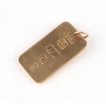 Property of a lady - a 9ct yellow gold ingot pendant, 41mm long including suspension ring,