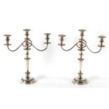 Property of a gentleman - a pair of 19th century Old Sheffield Plate three light candelabra, with