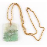Property of a lady - a Chinese carved jade pendant, 63mm long including suspension, on 18ct yellow