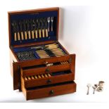 Property of a lady - a silver plated fiddle pattern cutlery set, in oak four-tier canteen;
