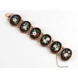 A Victorian unmarked yellow gold pietra dura panel bracelet, the six oval pietra dura panels