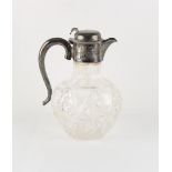 Property of a lady - a late Victorian silver mounted cut glass claret jug, the thumbpiece bent but