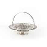 Property of a deceased estate - a George IV silver circular pedestal cake basket with swing