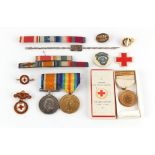 Property of a lady - a bag containing assorted medals, badges, etc., including a pair of Great War