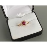 An unmarked 18ct yellow gold ruby & diamond cluster ring, the certificated unheated Thai round cut