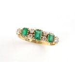 Property of a gentleman - an 18ct yellow gold emerald & diamond ring, the three rectangular cut