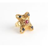 Property of a lady - Ilias Lalaounis - an 18ct yellow gold ruby sapphire & diamond ring, the concave