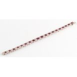 Property of a lady - an Art Deco platinum Burmese ruby & diamond bracelet, the nineteen graduated