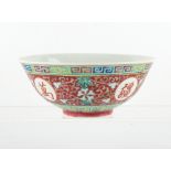 A Chinese famille rose ruby ground medallion bowl, probably Republic period (1912-49), short