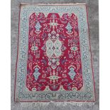 Property of a gentleman - a Persian Kashan hand knotted rug with red ground, 75 by 51ins. (190 by