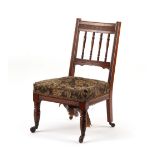 The Henry & Tricia Byrom Collection - a late Victorian oak spindle back nursing chair with turned