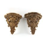 Property of a lady - a pair of late Victorian gilt painted wall brackets, 15ins. (38cms.) high (a/f)