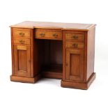 Property of a deceased estate - a late Victorian walnut kneehole desk with leather inset top, 41.