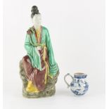 Property of a lady - a late 19th / early 20th century Chinese famille verte figure of Guanyin,