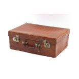 Property of a gentleman - an early 20th century leather faux crocodile skin suitcase, the locks