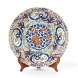 Property of a gentleman - a large Japanese Verte Imari dish, circa 1700, with lobed rim, painted